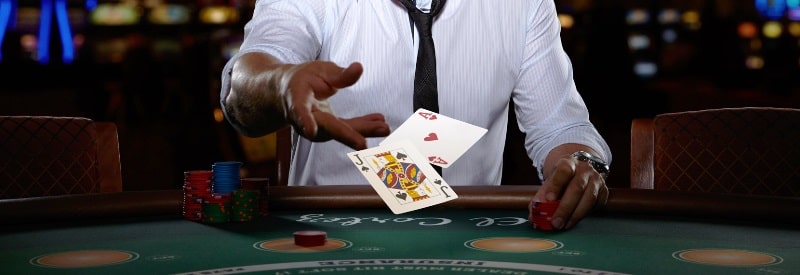 dealer throws cards during a blackjack game